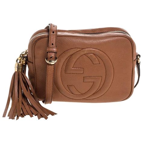 brown gucci crossbody with outfit
